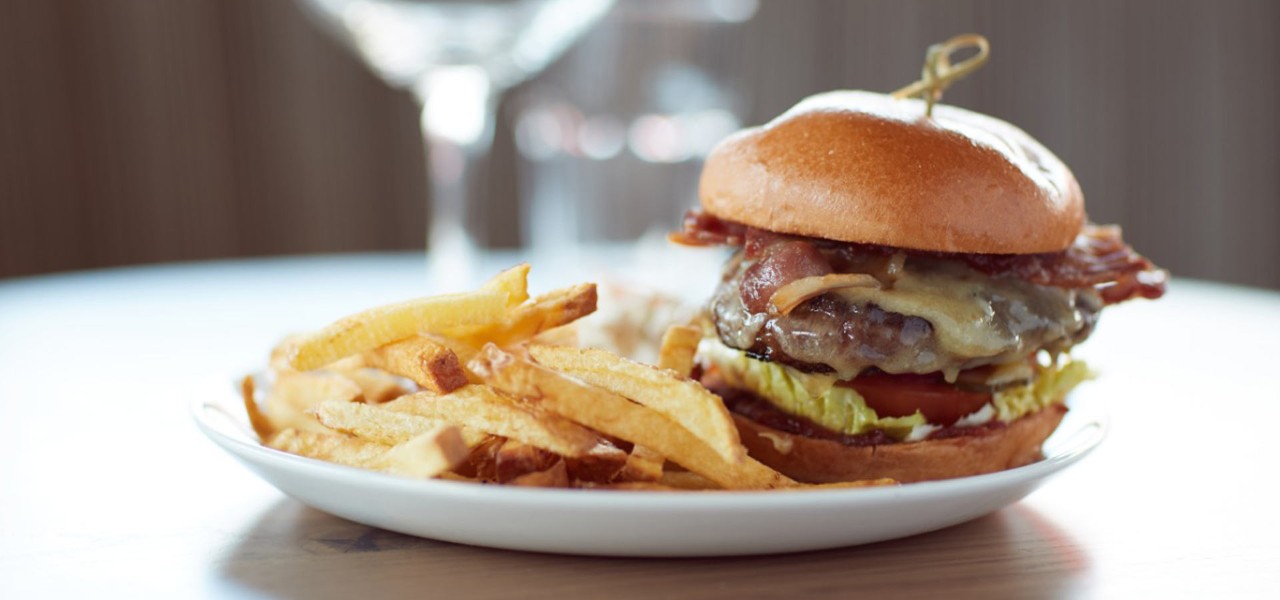 A plate with a burger and chips