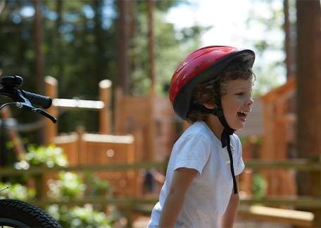 A toddler on his bicylce.