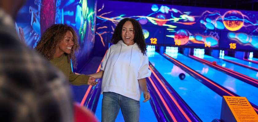 Mother and her son playing table tennis in the Sports Plaza.