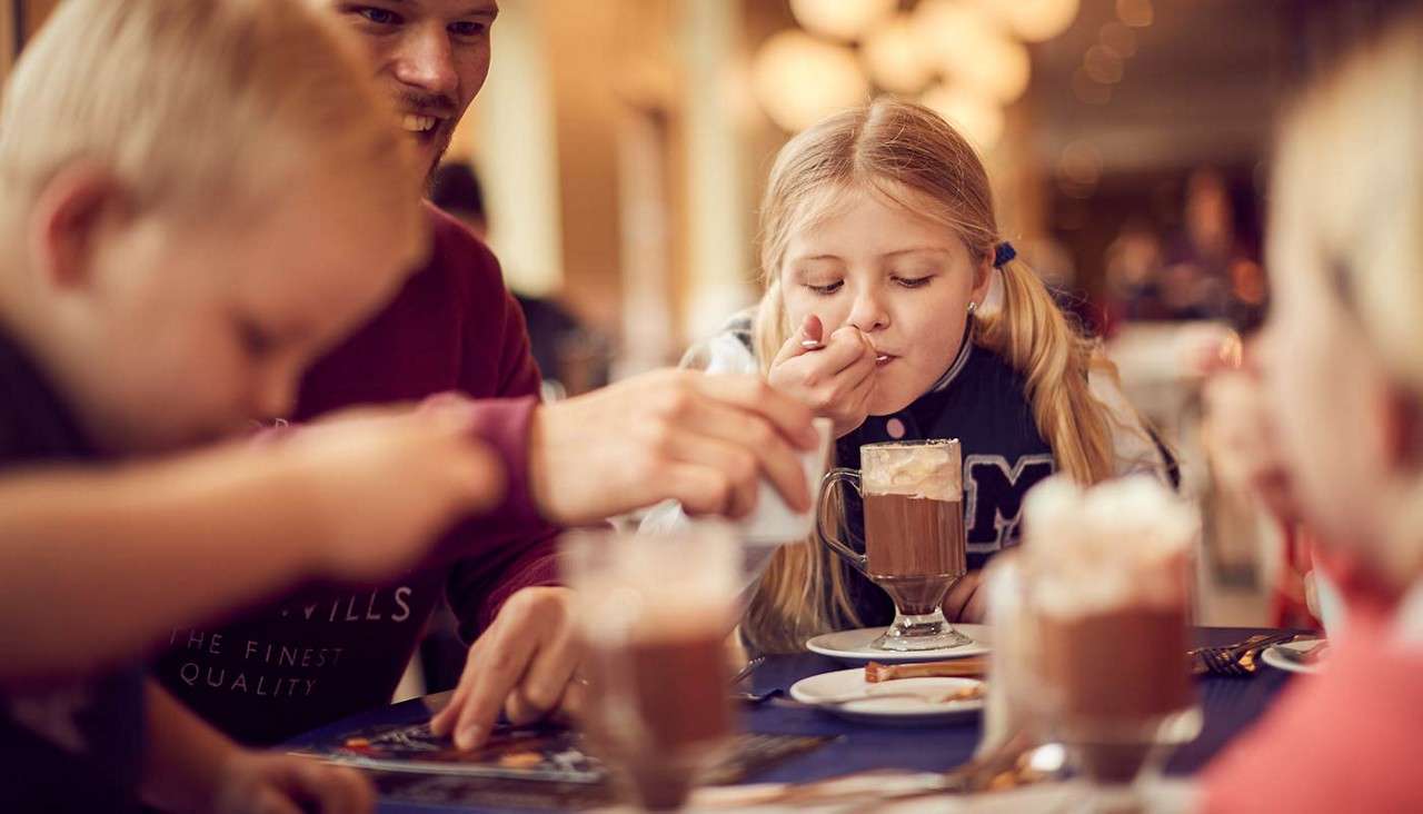 Family drinking hot chocolates