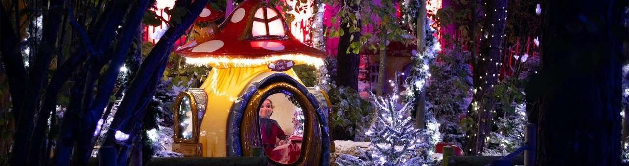 An elf in a toadstool at Santa's Woodland Village