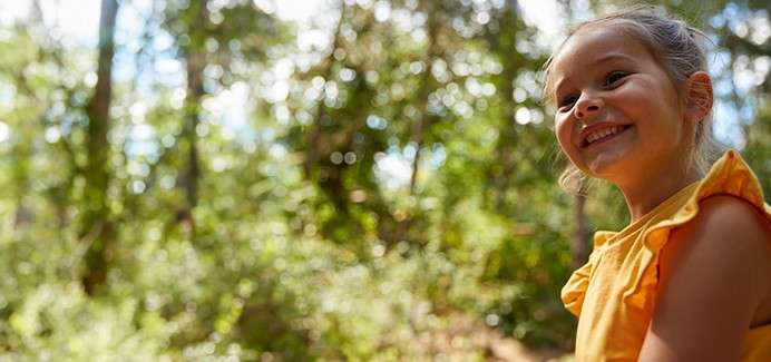A girl in the summer forest.