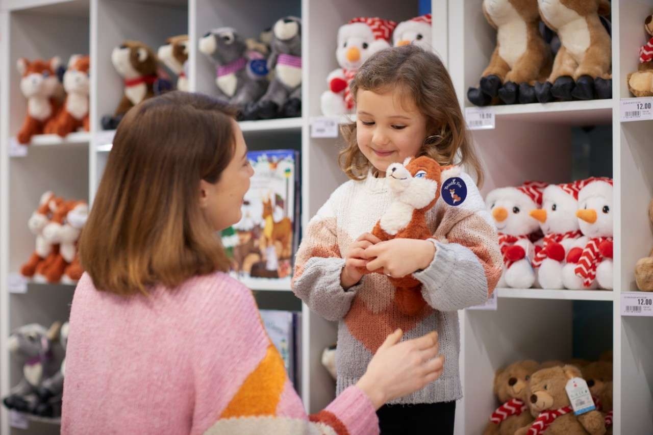 Girl holding a stuffed toy