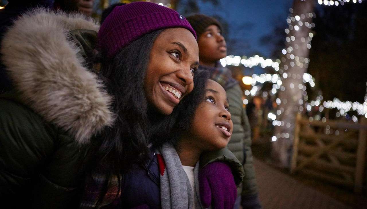 A family looking ahead at all the lights