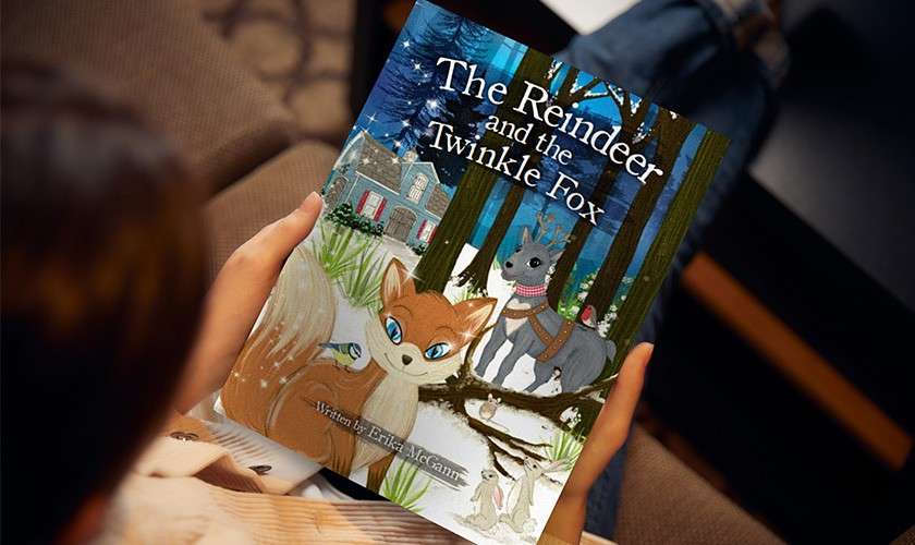 A child holding Nutmeg and Friends story book.