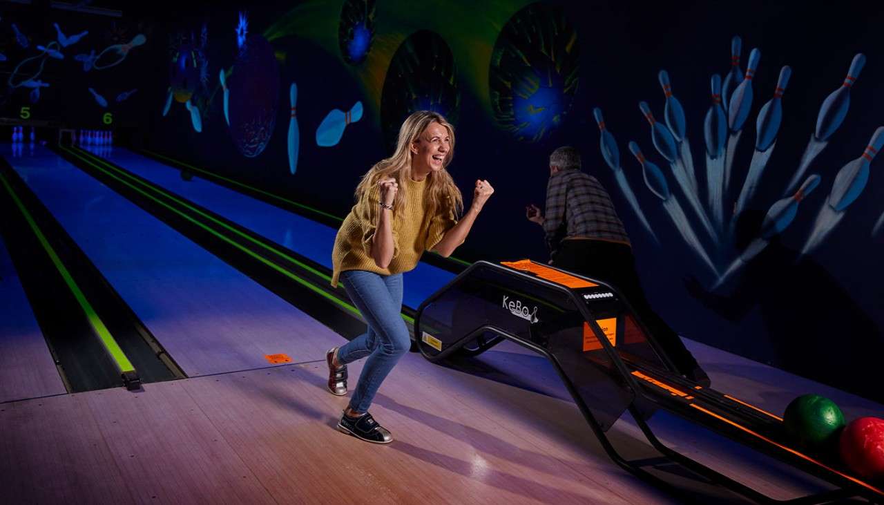 A woman bowling.