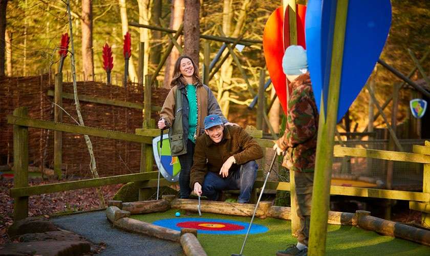 A family playing adventure golf together.