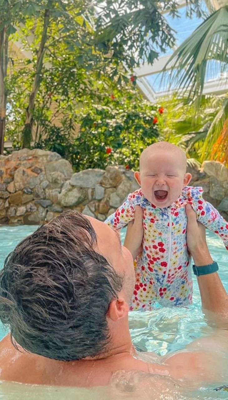 A baby and their dad in the subtropical swimming paradise water park