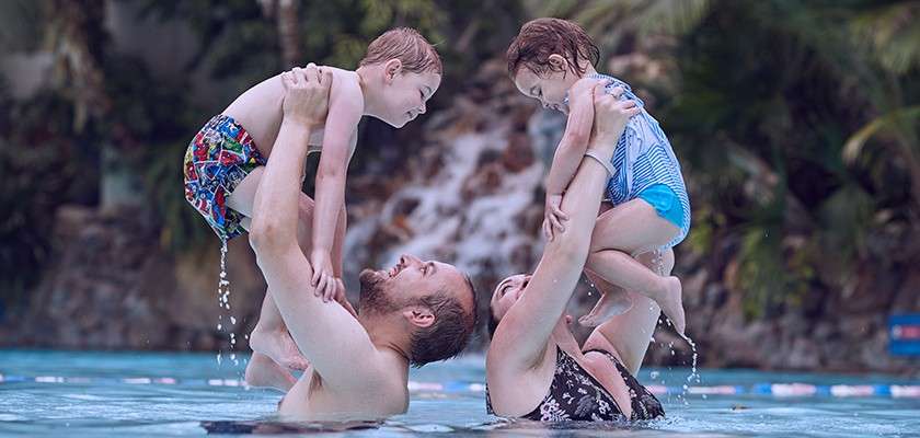 Parent and two children in the Subtropical Swimming Paradise