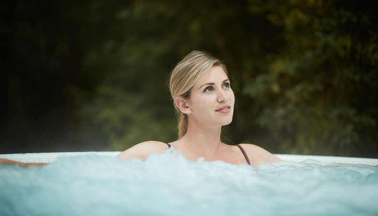 Woman relaxing in hot tub