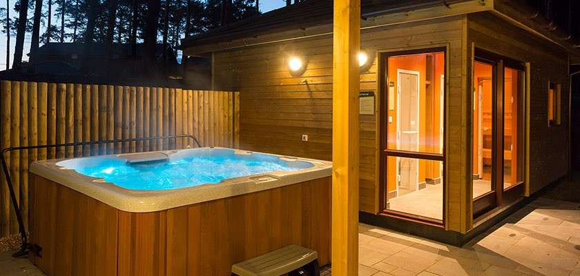 Private hot tub and sauna on patio area