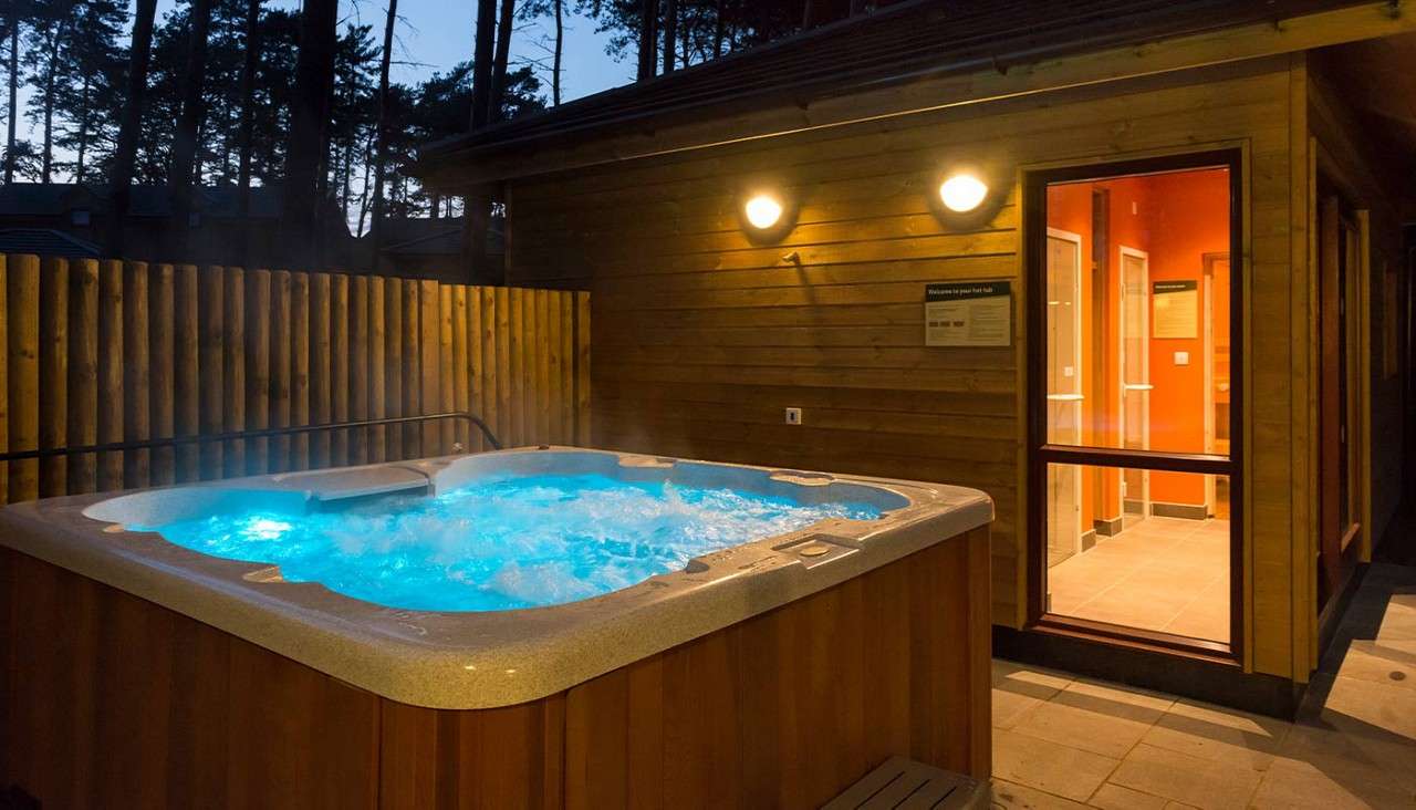 A woman in an outdoor hottub 
