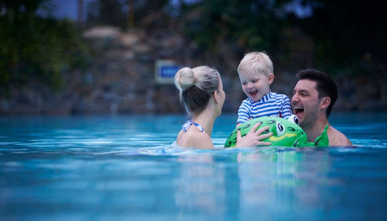 Family in Subtropical Swimming Paradise