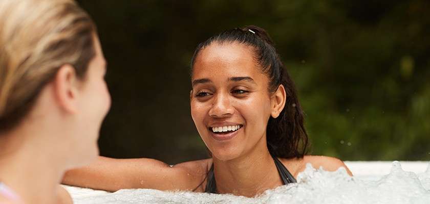 Two women relaxing in a hot tub