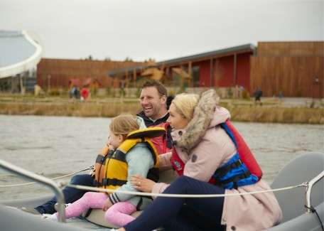 Family on electric boat