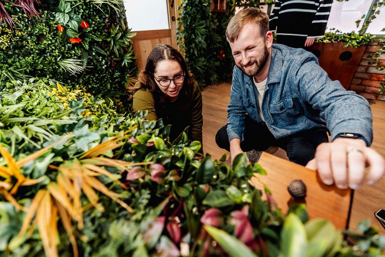 Two people looking for clues in a natural escape room.