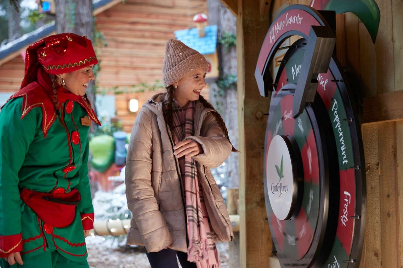 Young girl spinning a wheel to get her elf name.