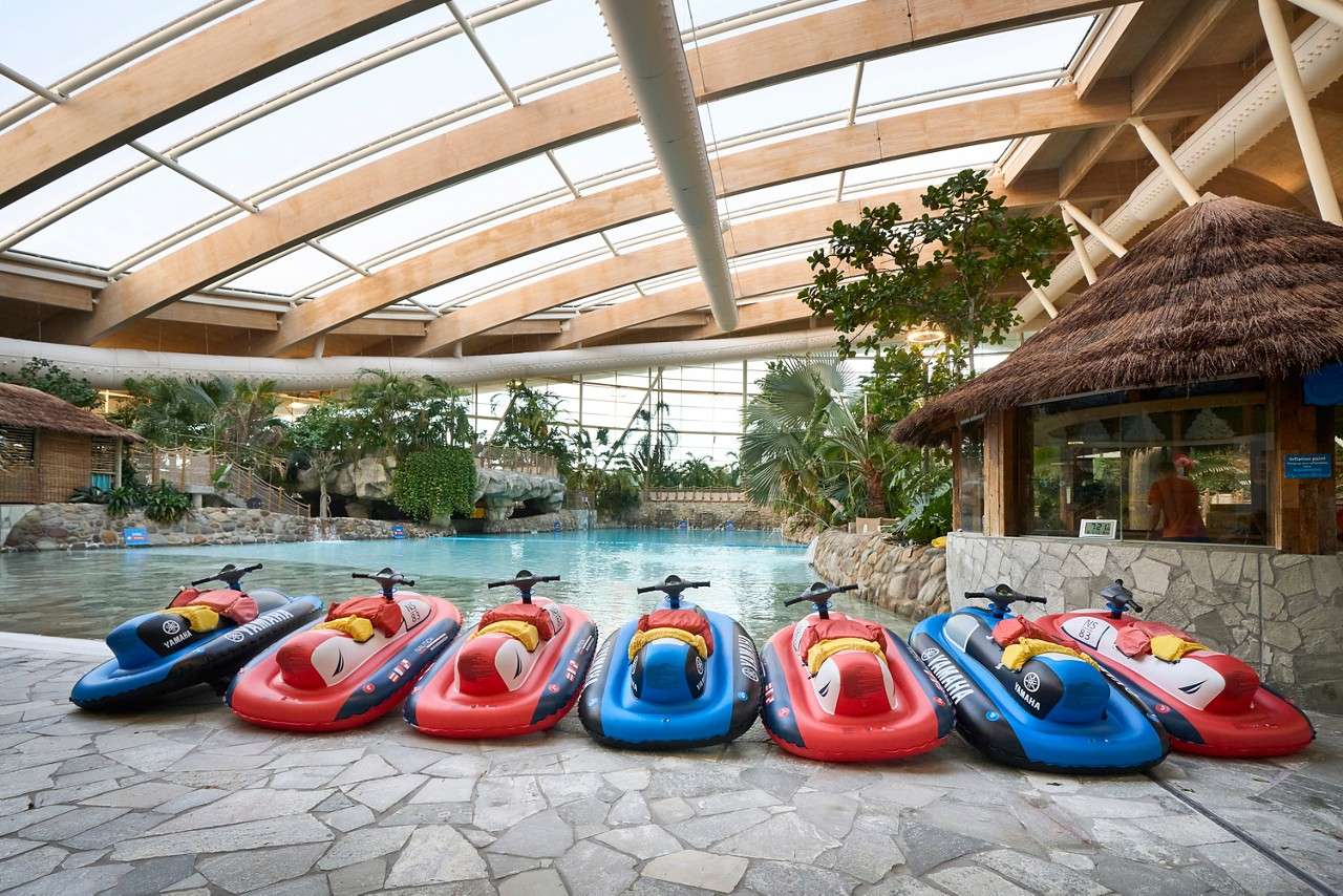 Mini Jet Skis lined up on the edge of the Wave Pool
