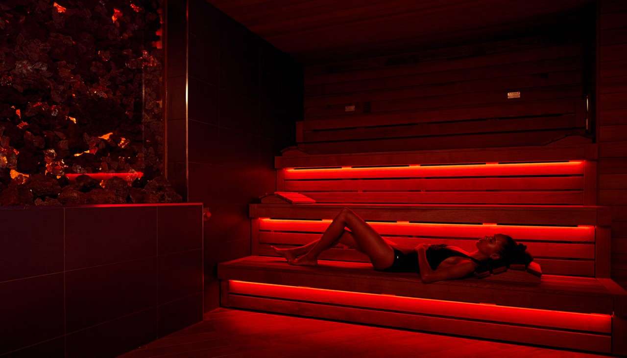 Woman laid in the Lava Sauna.