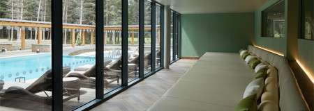 Lounge bed looking out to an outdoor pool