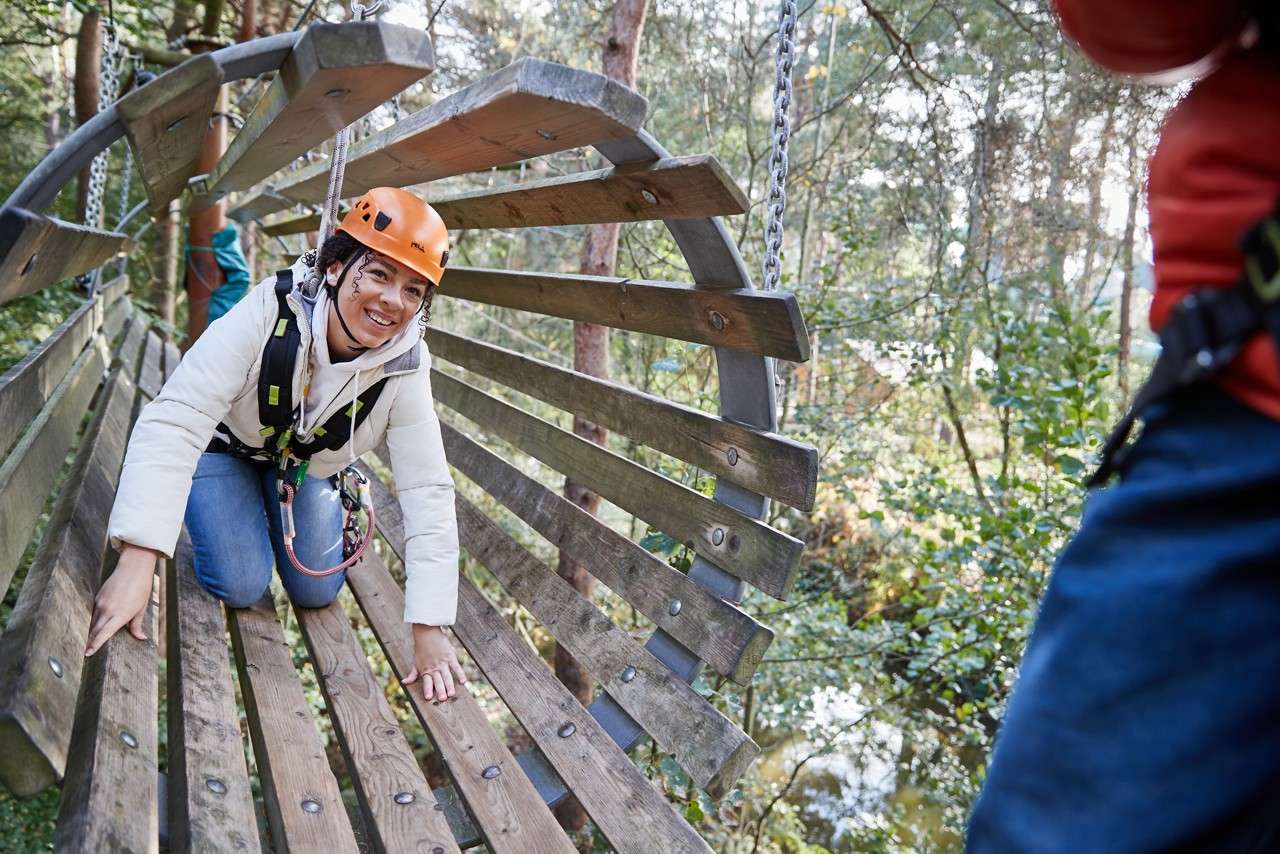 family completing aerial adventure