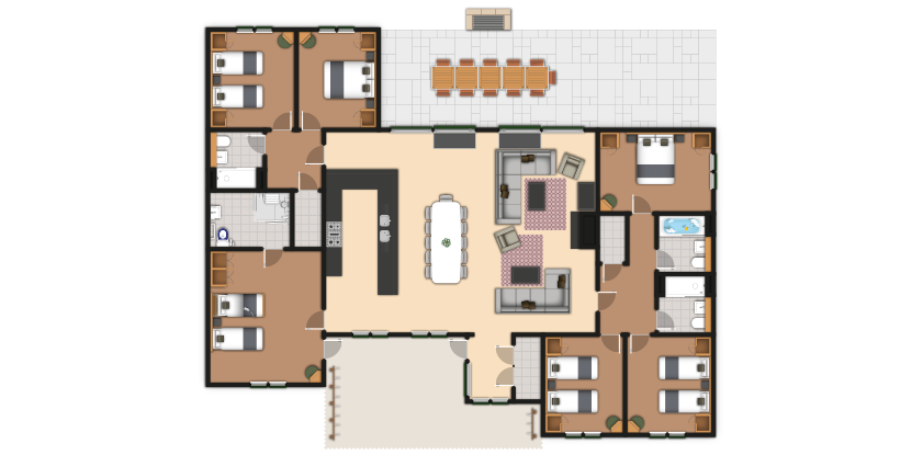 Floor plan shows a single-level home; bedrooms line both wings, central open kitchen with island and dining table, adjacent living area; multiple bathrooms; rear patio with a long outdoor table.