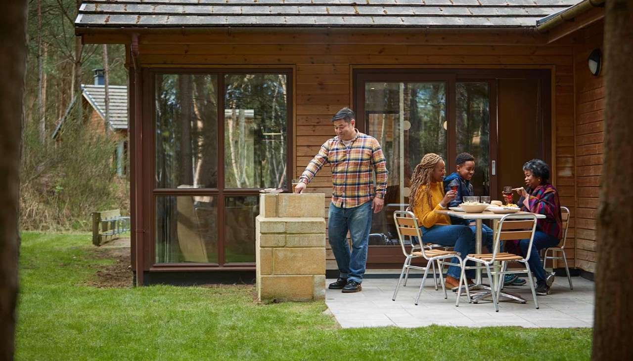 The exterior of a Woodland Lodge in the forest 