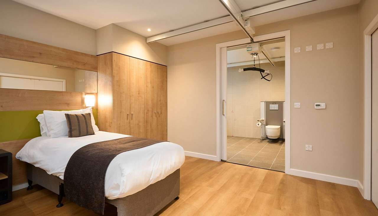 Twin bedroom with electric bed.