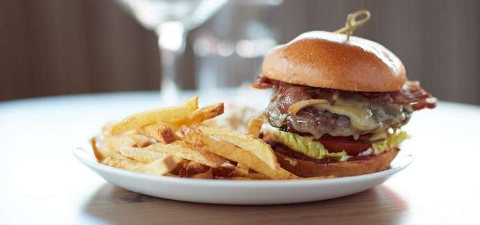 A plate with a burger and fries