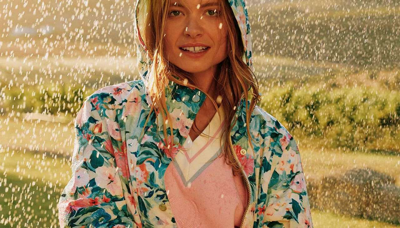Woman in a colourful raincoat.