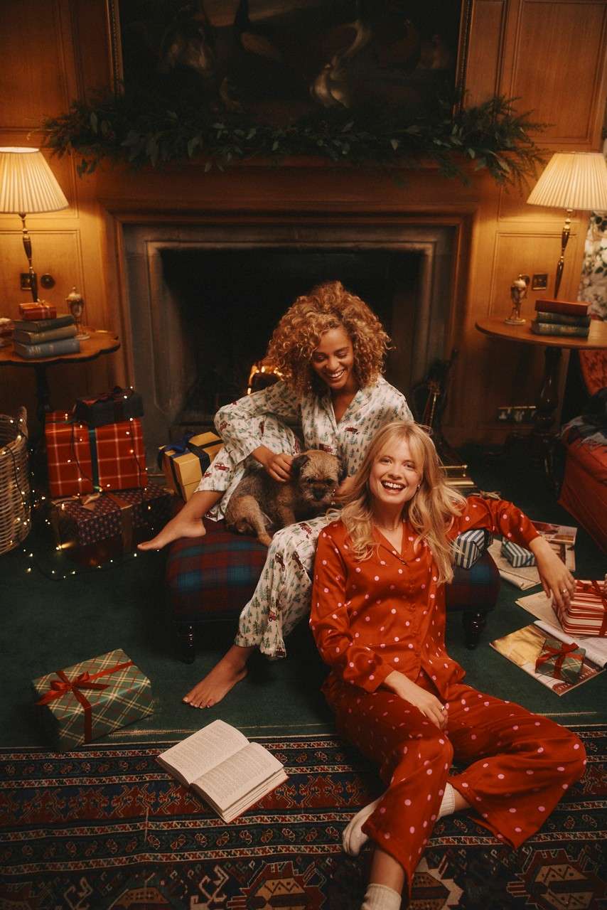Two women in festive pjs.