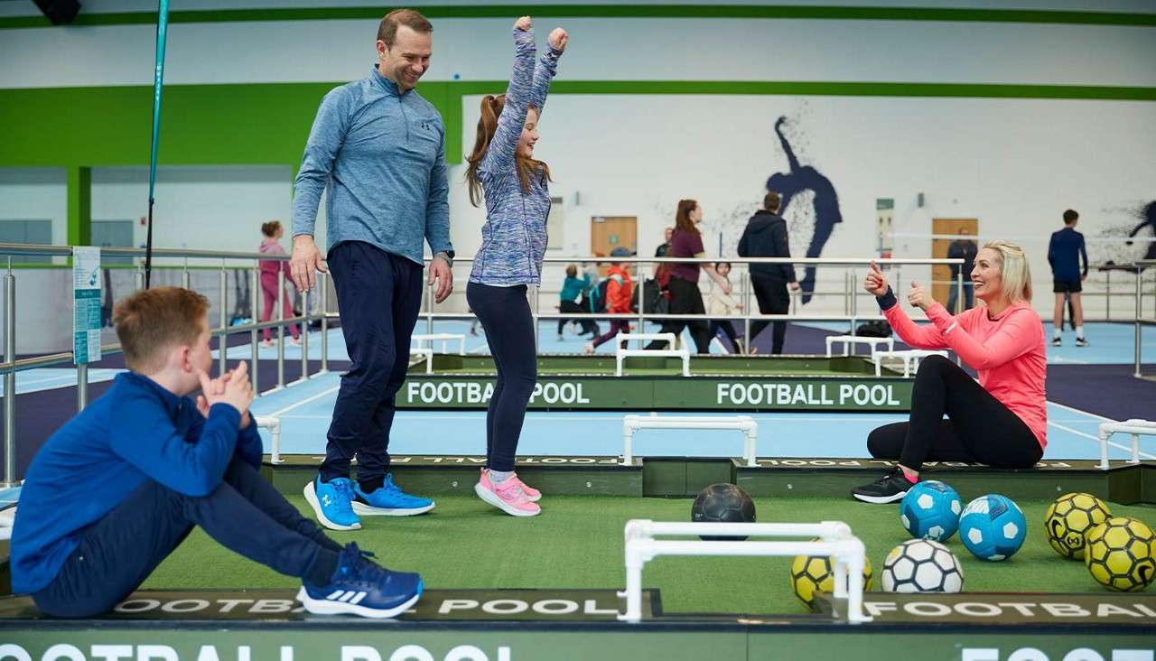 A family playing football pool together.