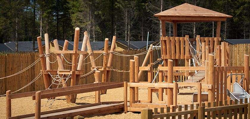 A wooden climbing frame in the outdoor adventure playground 