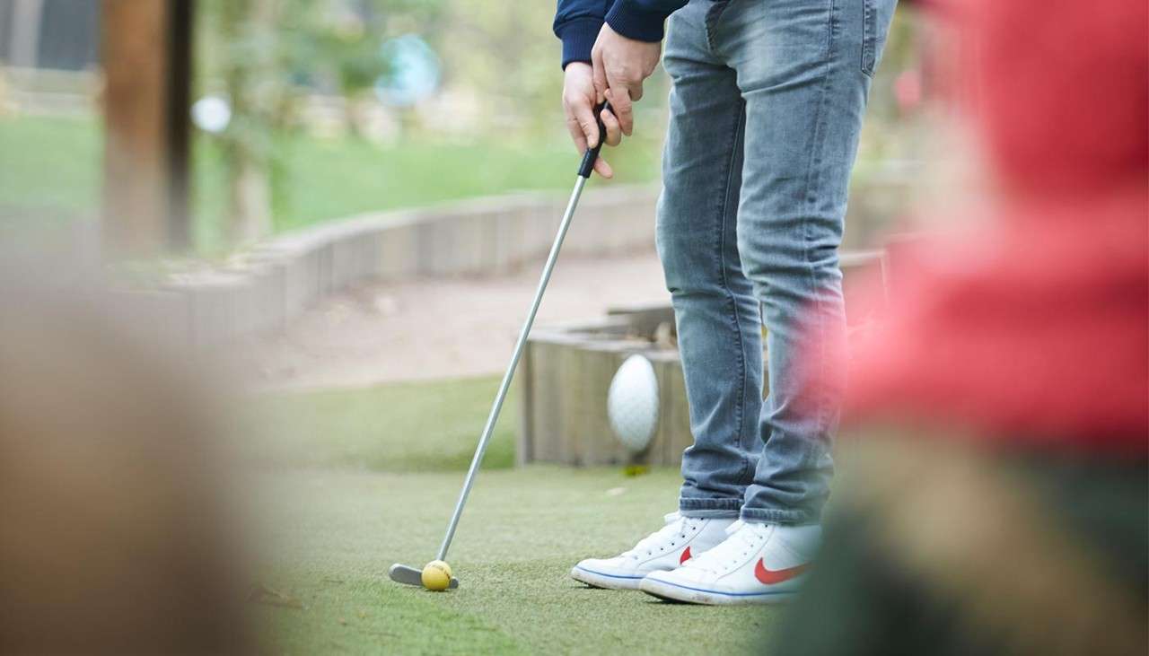 Man playing Adventure Golf