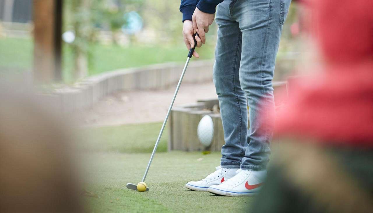 Man playing Adventure Golf