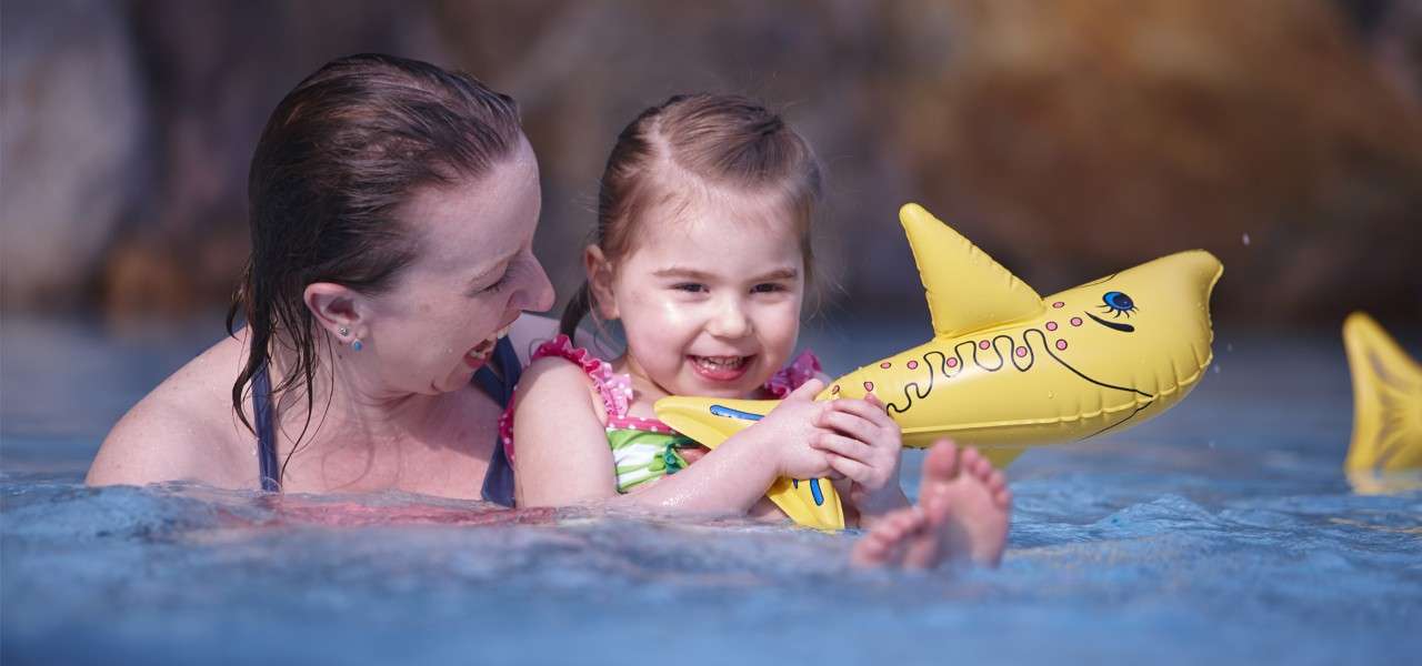 Mother and child in the subtropical swimming paradise