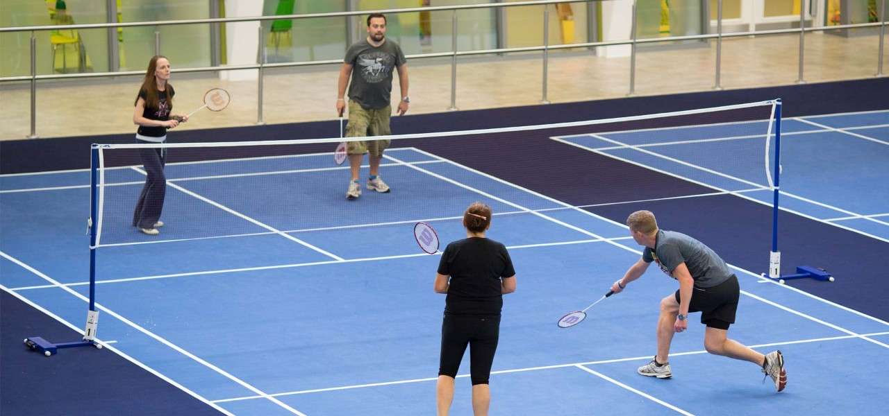 family playing badminton