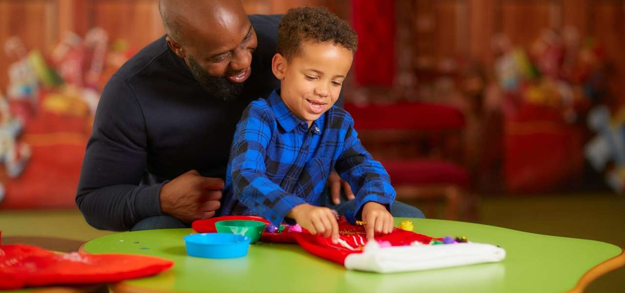 family taking part in design a christmas stocking session