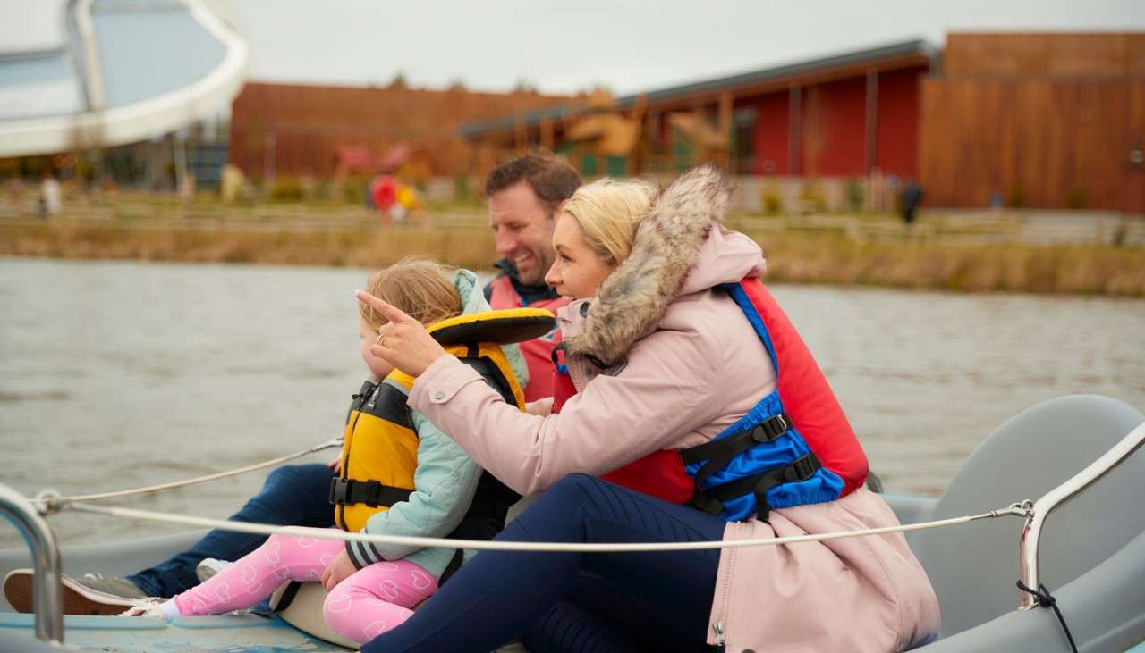 Family sitting in an electric boat