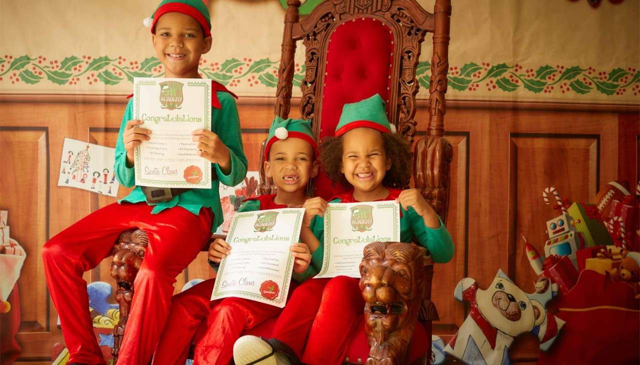 Three children holding a certificate
