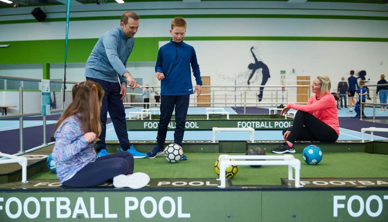 Family playing football pool