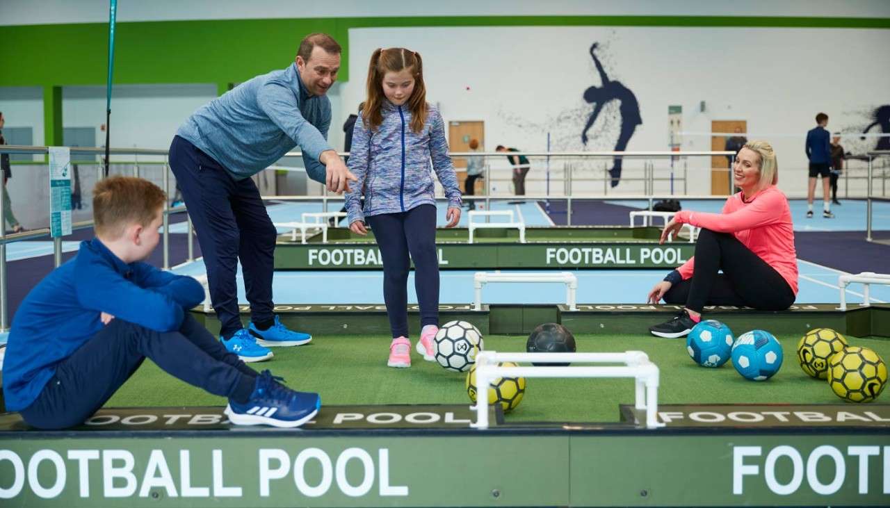 Family playing football pool