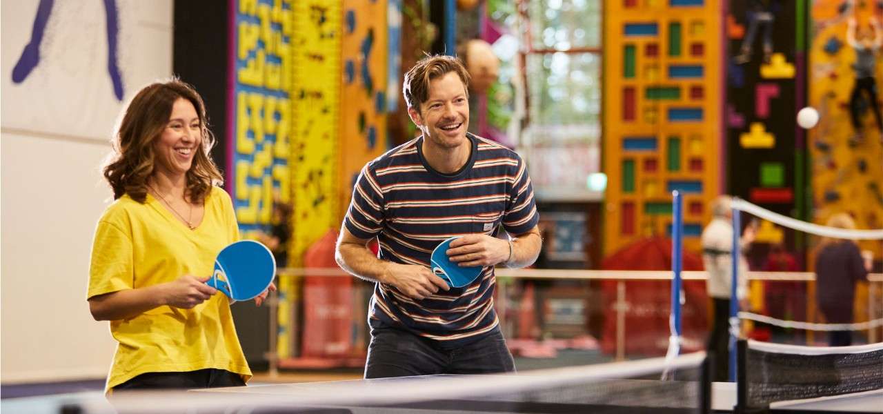 couple playing table tennis