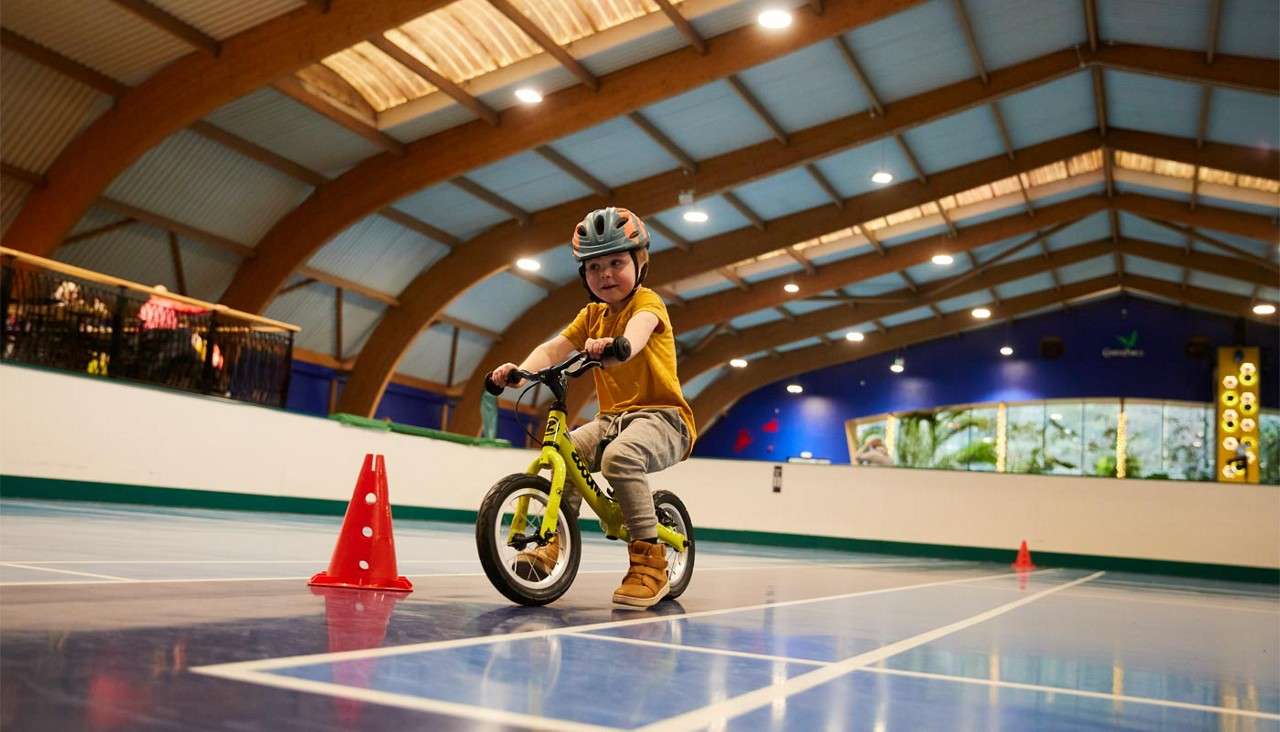 Young child riding on a balance bike