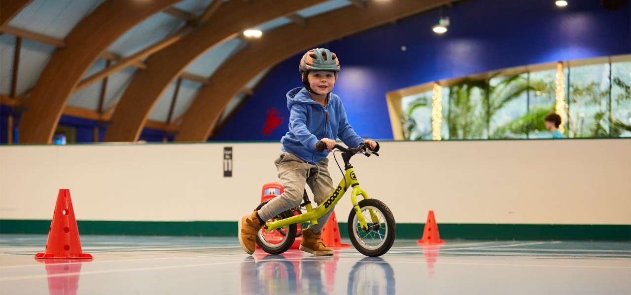 Young boy riding on a balance bike