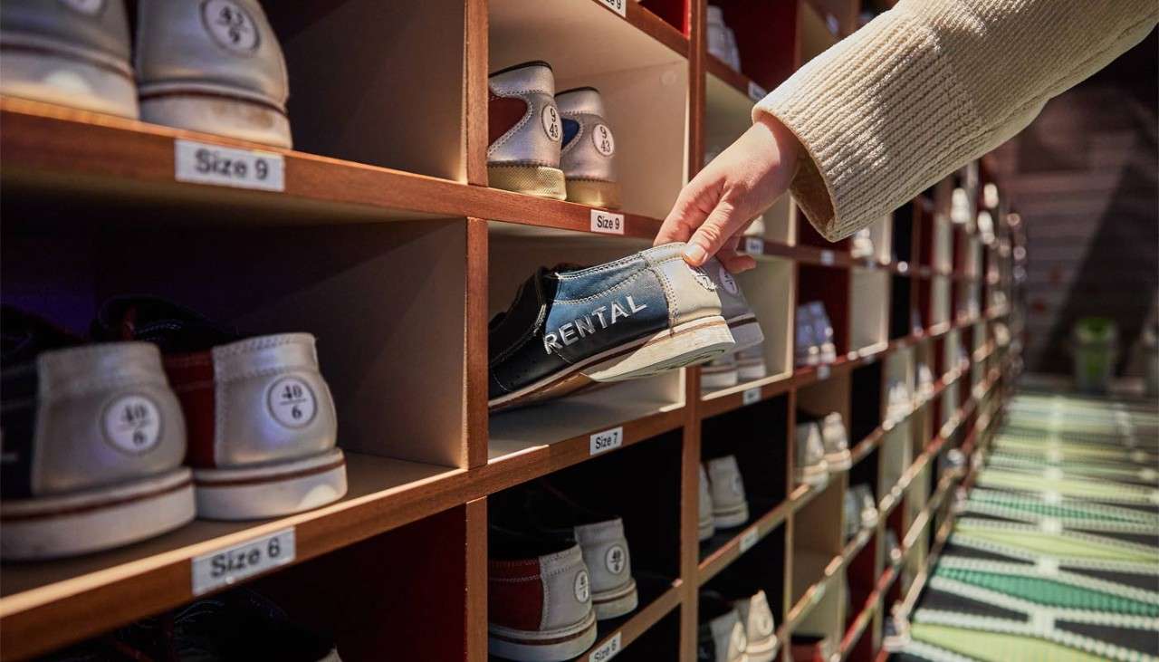 Person collecting rental bowling shoes