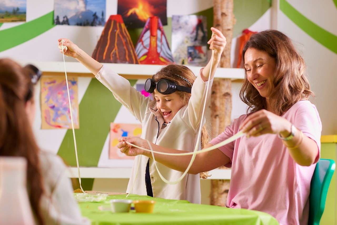 Children stretching out crazy science experiements. 