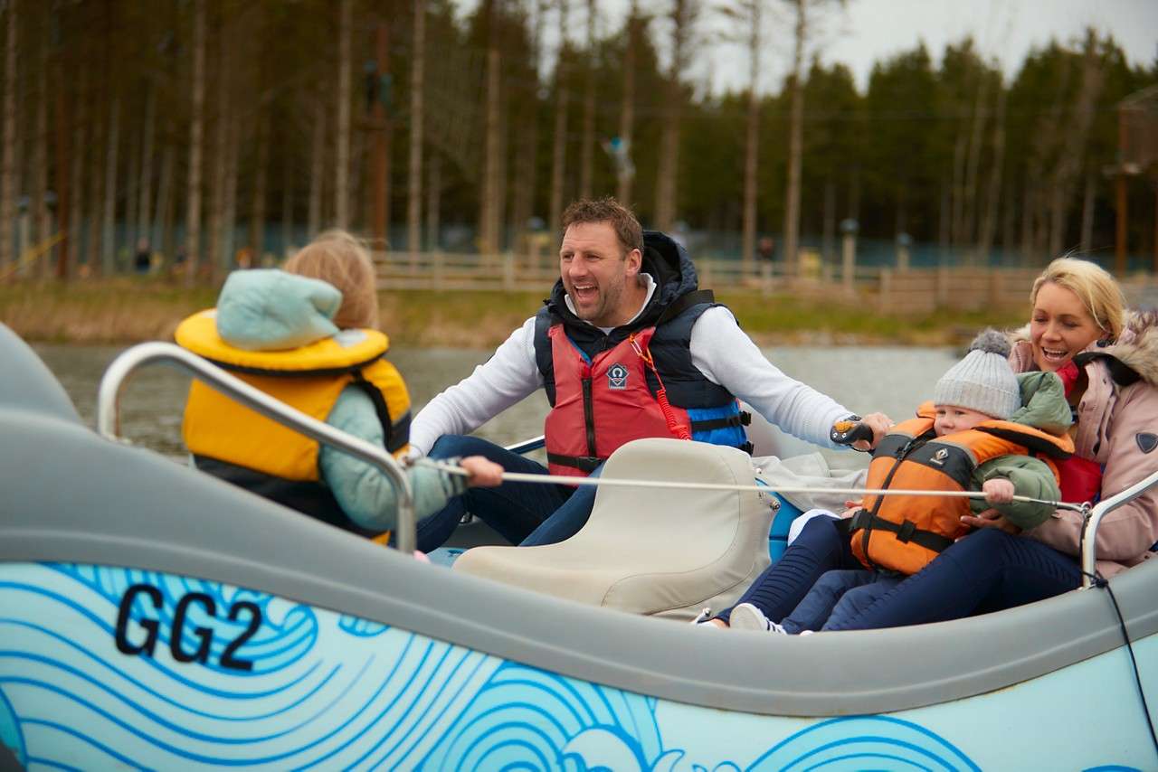 People smiling in their boat