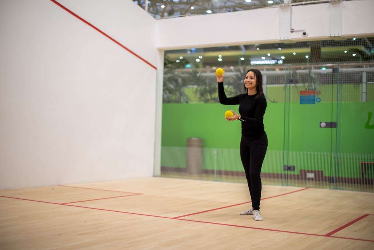A lady getting ready to throw the ball 