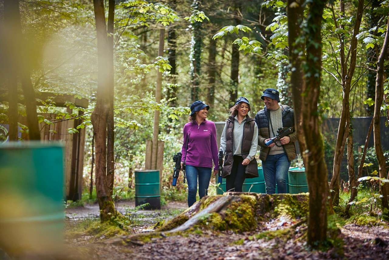 A family walking through the forest talking together